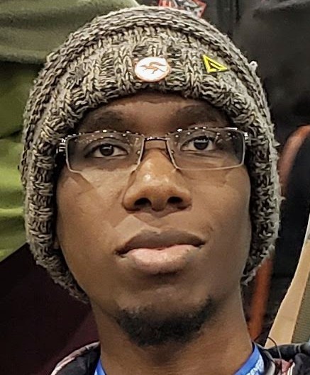A selfie, where I'm wearing a wool beanie with a Star Fox pin
